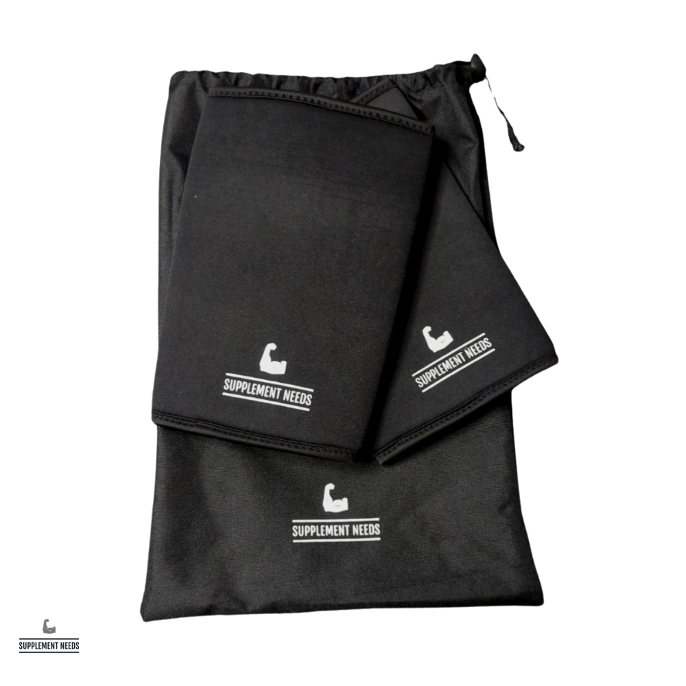 A pair of black neoprene elbow sleeves with subtle silicone branding, displayed in a drawstring bag.